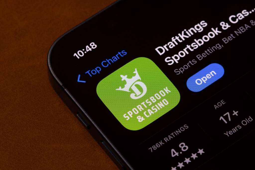 portland, or, usa nov 11, 2024: draftkings sportsbook and casino app is seen in the app store on the screen of an iphone.
